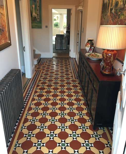 Red and yellow tiled mosaic hallway