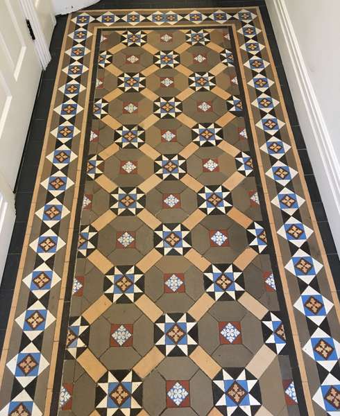 Finished mosaic hallway floor in London home